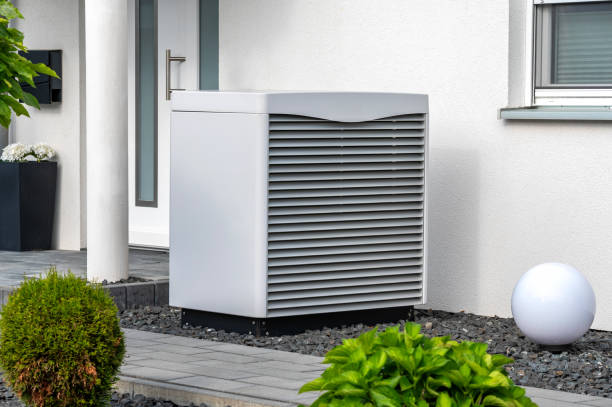 istock Modern heat pump in a front garden as an environmentally friendly variant of a heating system 1553264173
