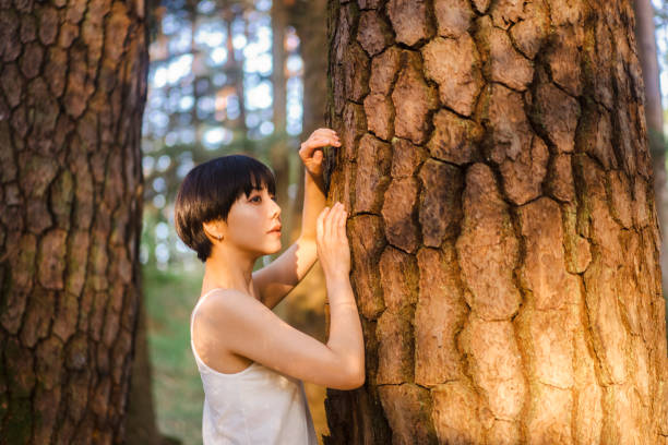 happy woman resting in nature in the field summer vacation trees grass. High quality photo