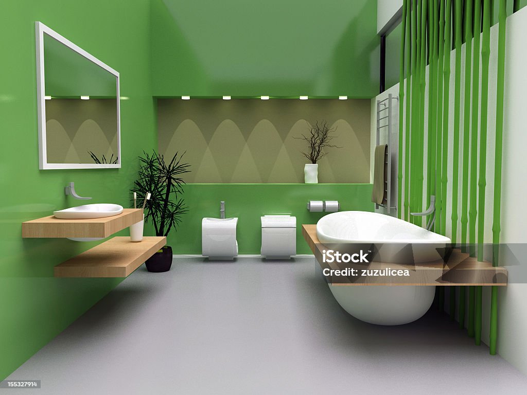 Modern bath with green walls and flooring a modern interior of a bathroom. Free Standing Bath Stock Photo