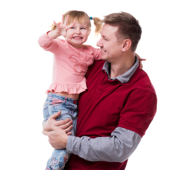 istock father holding little daudgter in his arms 1553279913