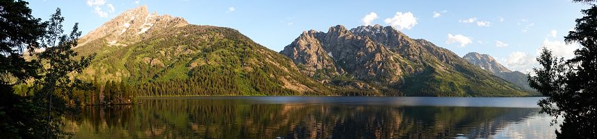 Teewinot Mountain (left) on Jenny Lake. The mountain is at 12,330ft (3,758m) sixth tallest on the Teton Range and it got its name from the Shoshoni word for 'many pinnacles'. Next to Teewinot is Mt St John and Rockchuck Peak. Jenny Lake, formed about 12,000 years ago by glaciers, was named for a Shoshone Indian woman who was the wife of an Englishman named  Richard 'Beaver Dick' Leigh. Sadly Jenny and her six children were, in 1876, victims of smallpox.