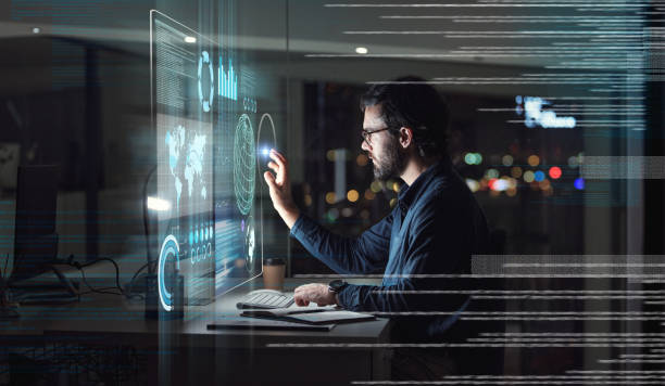 istock Computer, hologram and touchscreen of business man with data analysis, digital coding and programming at night. holographic, software overlay of IT person, information technology research and desktop 1553290828