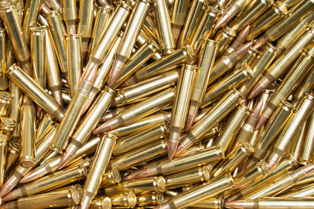 istock Rifle bullet cartridges, background 1553297910
