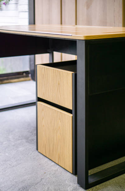 istock Empty rough wooden table top in the dark room 1553309473