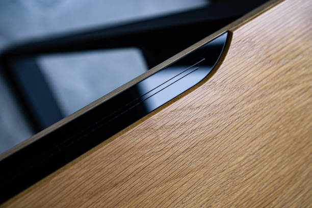 istock Empty rough wooden table top in the dark room 1553309487