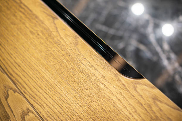 istock Empty rough wooden table top in the dark room 1553312718