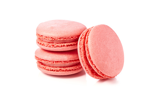 Three pink macaroons isolated on white background