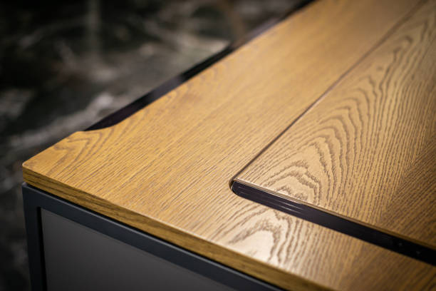 istock Empty rough wooden table top in the dark room 1553314961
