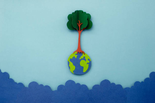 istock Tree on earth made of paper cut. 1553321711