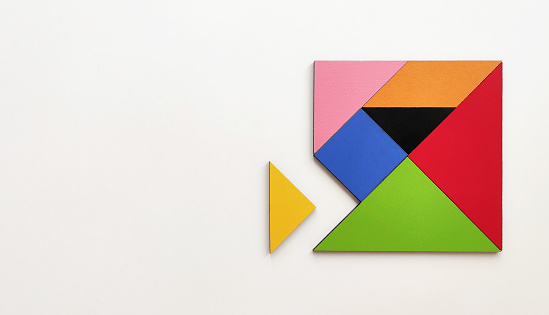 Tangram puzzle with copy space on white background