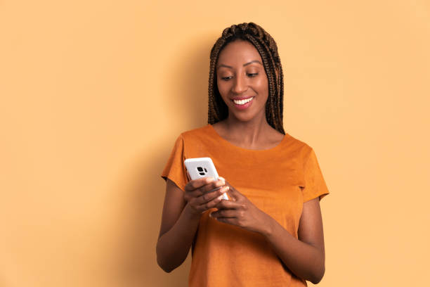 istock happy black woman checking smartphone 1553327025