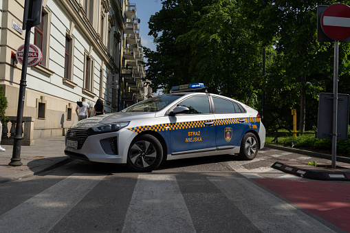 Krakow, Poland - May 20, 2023: Municipal Police of Kraków, Hyundai car. Polish city guard officers, Straż Miejska patrol vehicle.