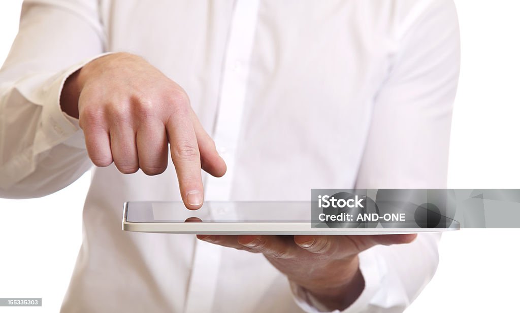 Using a digital tablet Hands of a businessman using a digital tablet pc Adult Stock Photo