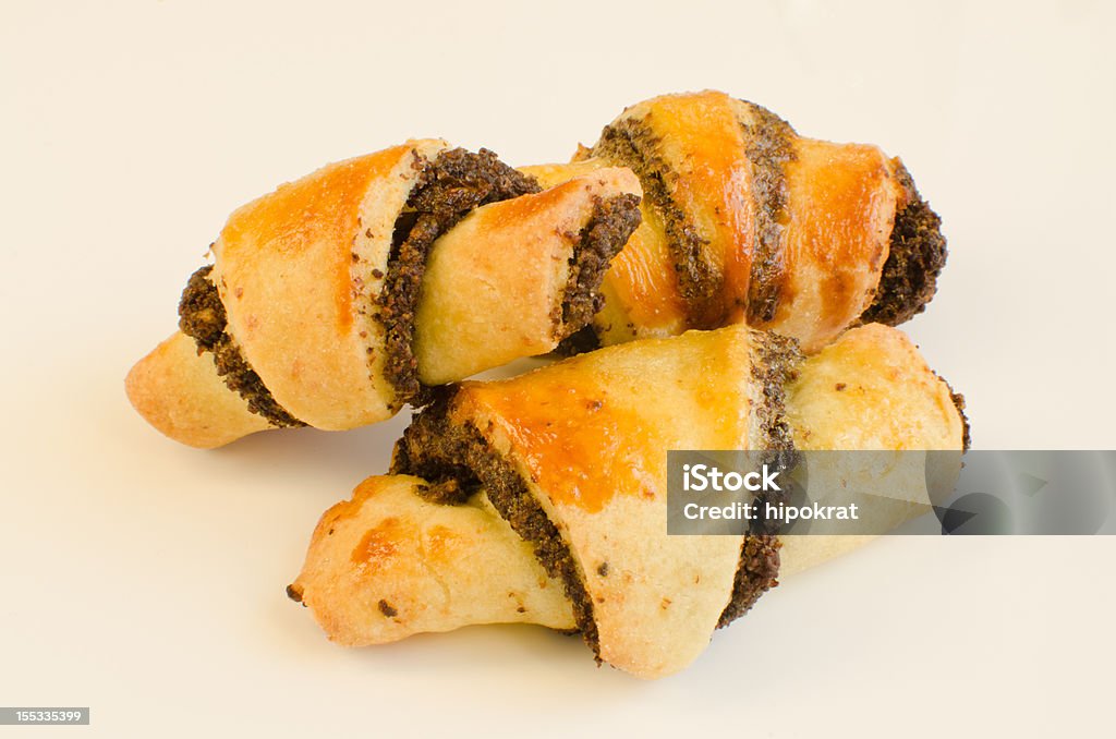 Rugelach with poppy seed filling Rugelach is a traditional Jewish pastry that is eaten any time of year, including, but not limited to Shabbat. Baked Stock Photo