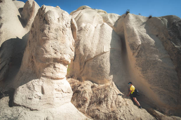 istock Woman tourists standing on stony mountain 1553365754