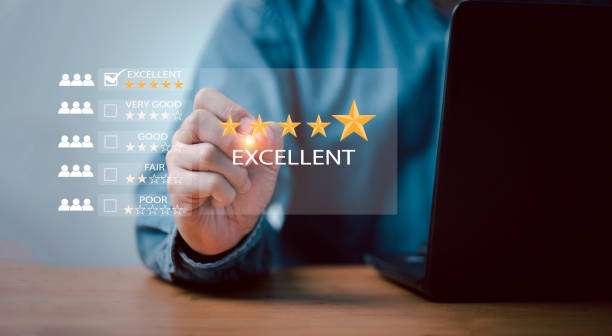 istock Businessman using laptop computer to give golden five stars for client the best satisfaction evaluation survey after use product and service concept. 1553376727
