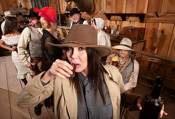 istock Cowgirl Sips Whiskey in Tavern 155337757