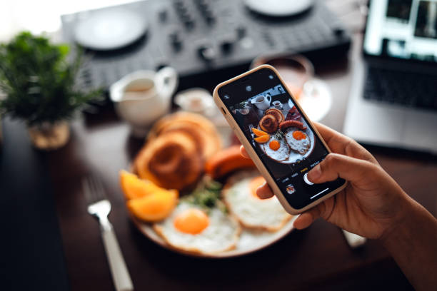 istock Breakfast pancakes, fried eggs, bacon, sausage and coffee. 1553384803