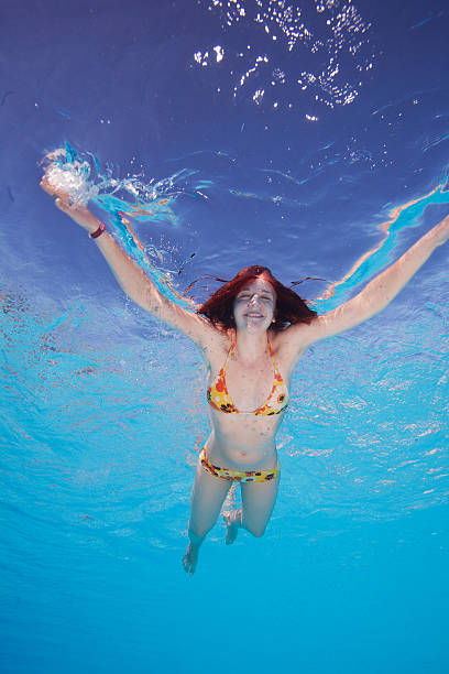 istock Happy young woman in the water 155338687