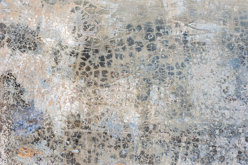 chaotically cracked old concrete wall surface.