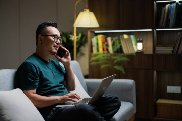 istock Asian  white-collar workers use their phones to contact work at home 1553389466
