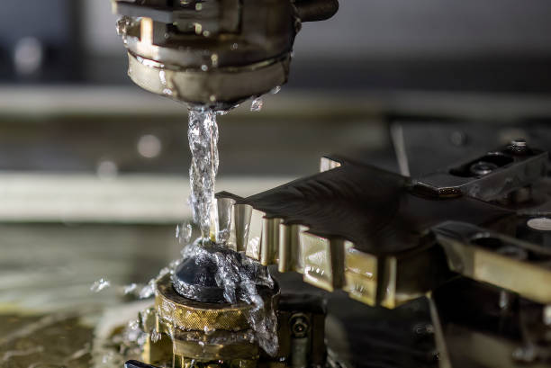 istock Closeup scene the wire EDM machine cutting the mold insert parts. 1553399448