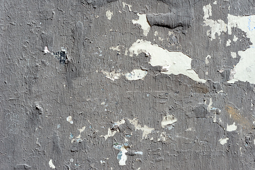 Gray painted torn posters close up texture background