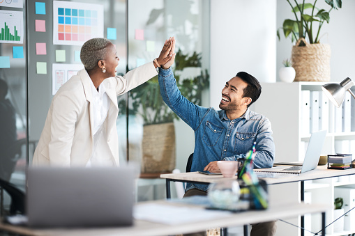 High five, happiness and business people celebrate teamwork, website design achievement or company success. Office team building, happy winner and excited staff celebration for creative development