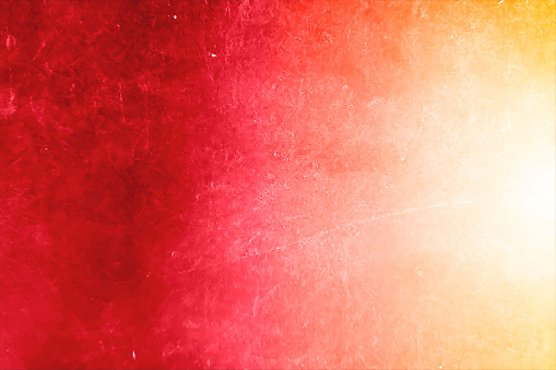 Horizontal vector illustration of an old bright red and orange color gradient smudged effect, empty, blank, wall texture colorful vector background. Suitable for Holi, festive celebrations related backdrops, posters, wrapping paper sheets or greeting cards templates. There is no text and ample copy space.