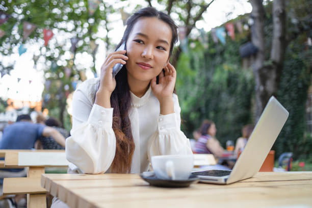 istock Female Manager Talking on Smartphone 1553421194