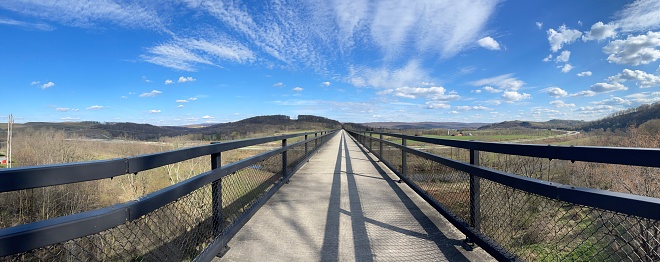 Panoramic view straight ahead of the viaduct along the trail in Pennsylvania.