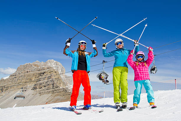 Family on ski slope stock photo