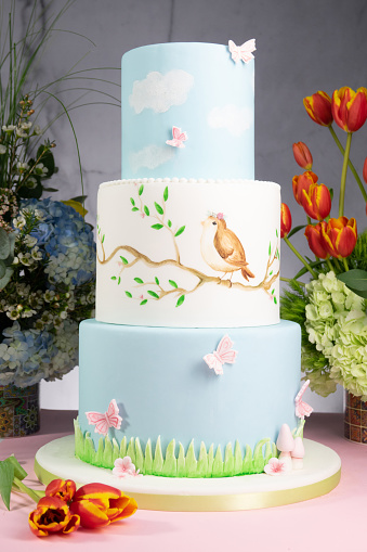 Easter cakes on a marble background and flowers