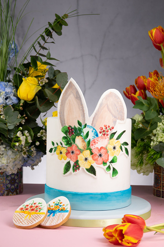 Easter cakes on a marble background and flowers