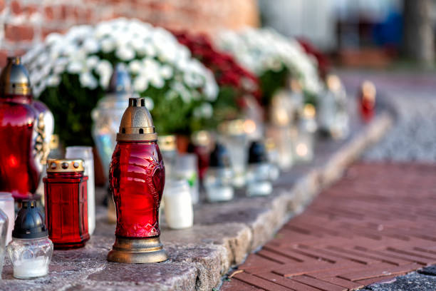istock cemetery with flowers and grave candles 1553467167