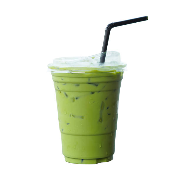 istock Iced Matcha green tea on glass isolated white background. 1553473354