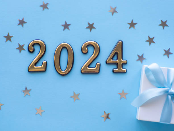 istock 2024 on blue background with gift box and silver stars 1553476062
