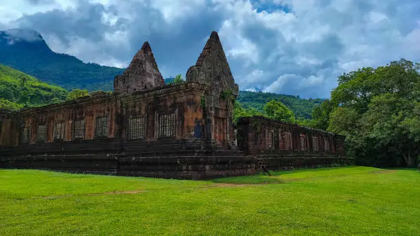 Photo of The beautiful view landscape of the blue cloud top of green forest, in Wat Phou/vat Phou Hindu temple complex is the UNESCO world heritage site in Champasak, Southern Laos.