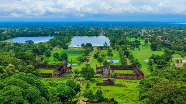 Photo of The famous beautiful top view landscape of the blue cloud top of green forest, in Wat Phou/vat Phou Hindu temple complex is the UNESCO world heritage site in Champasak, Southern Laos.