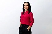 Portrait of Brazilian business woman over neutral background. Confident young latin businesswoman