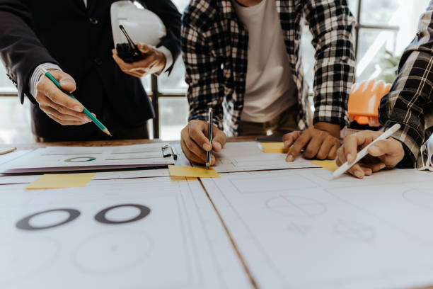istock Civil engineer team meeting Modern construction planning meeting, foreman, industrial project manager, engineering team, professional team in Asian industry 1553498606