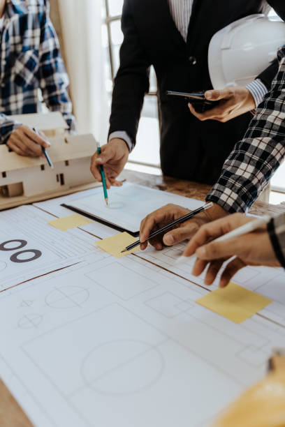istock Civil engineer team meeting Modern construction planning meeting, foreman, industrial project manager, engineering team, professional team in Asian industry 1553498607
