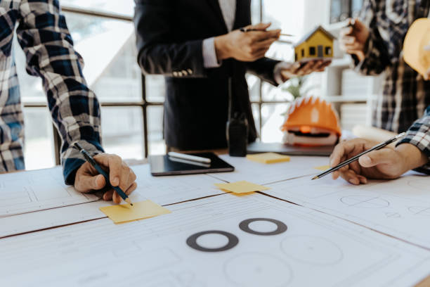 istock Civil engineer team meeting Modern construction planning meeting, foreman, industrial project manager, engineering team, professional team in Asian industry 1553499146