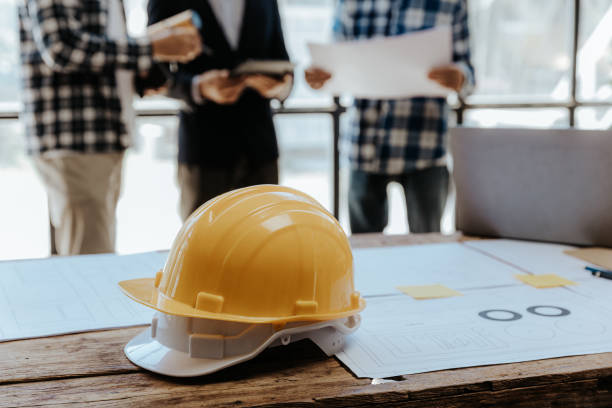 istock Civil engineer team meeting Modern construction planning meeting, foreman, industrial project manager, engineering team, professional team in Asian industry 1553499709