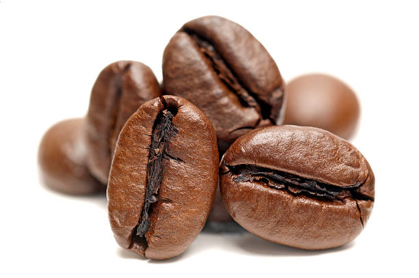 Macro of Coffee Beans on white background stock photo