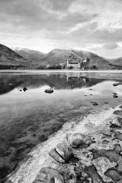 Kilchurn Castle Looking across a partly frozen Loch Awe to Kilchurn Castle on a winter's evening. scottish highlands photos stock pictures, royalty-free photos & images
