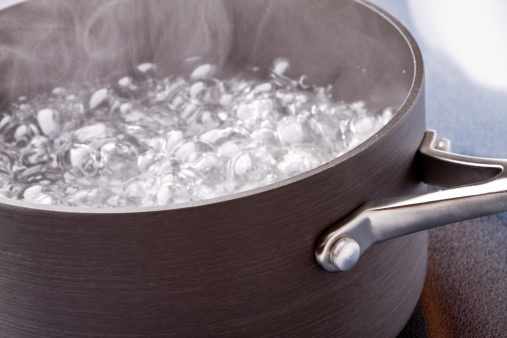 Boiling Water in a pan on a stove