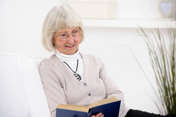 istock Caucasian Senior Woman With Spectacles Enjoying A Book 155350739