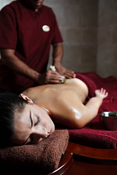 istock Young woman getting a navarakizhi massage 155350882