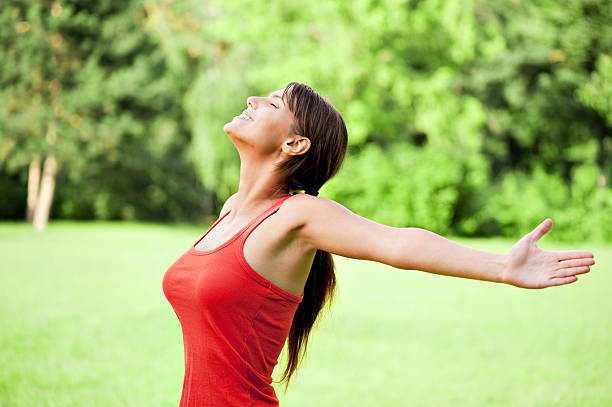 istock Beautiful young woman in the park 155350902
